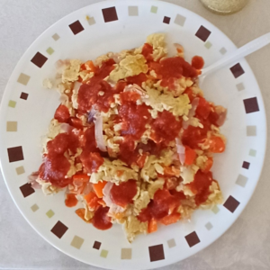 roaring red eggs with tomato sauce drizzle