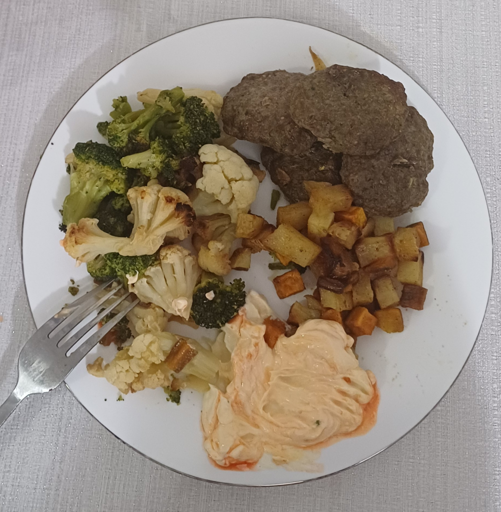 meat patties , broccoli and cauliflower, and potatoes
