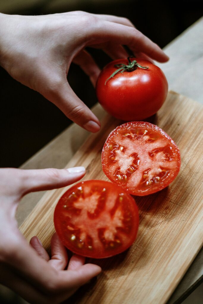 Photo by cottonbro studio: https://www.pexels.com/photo/person-holding-red-tomato-fruit-3943195/